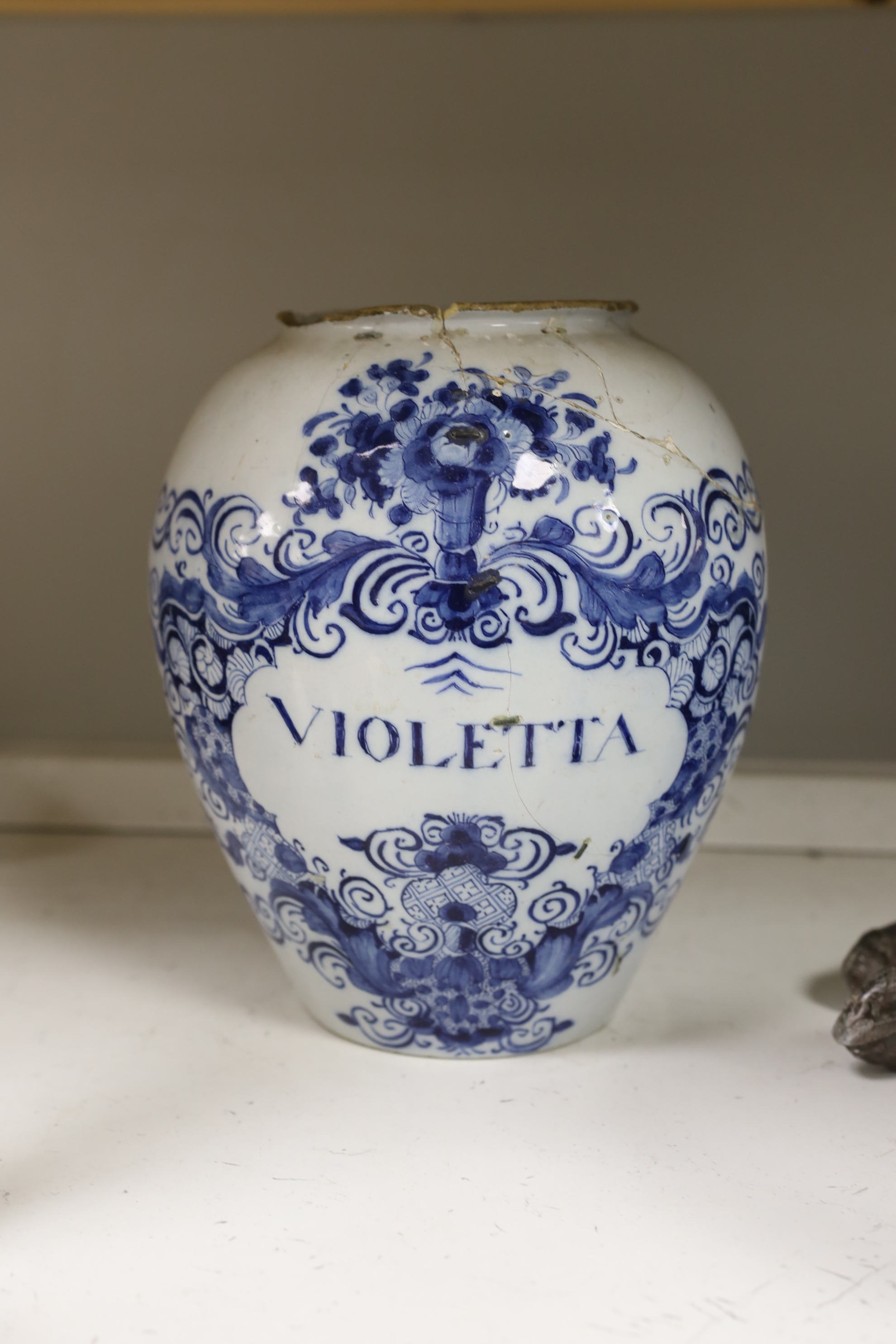 A set of three 18th century Delft drug jars, a similar large Violetta jar, Duyn mark, and a pair of 18th century Delft vases, tallest 28cm high